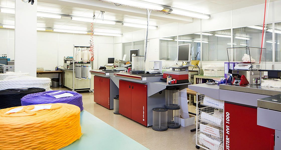 QSP Textile laboratory with modern textile production equipment and coloured yarn samples